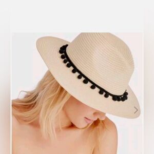 Sole society hat with black Pom poms